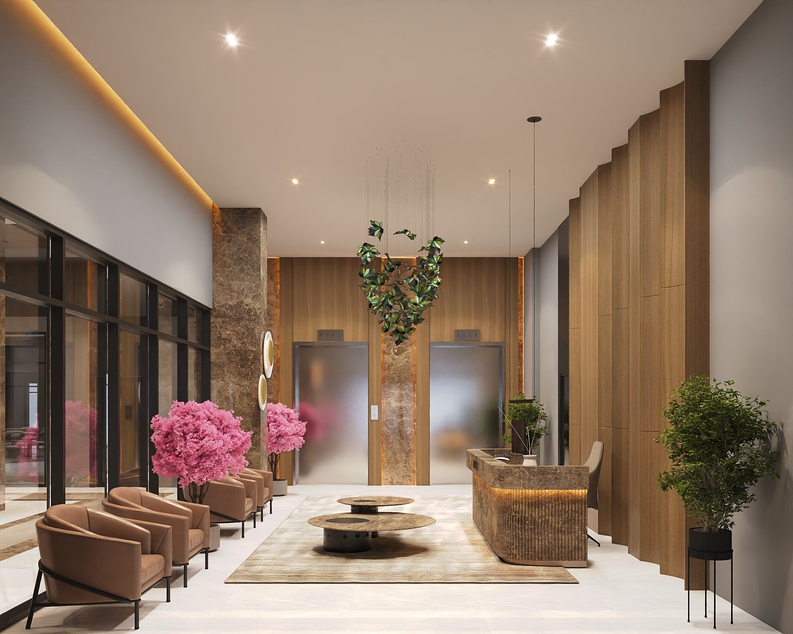Lounge with armchairs and pink trees beside the lifts